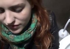 Public toilet blowjob with young redhead